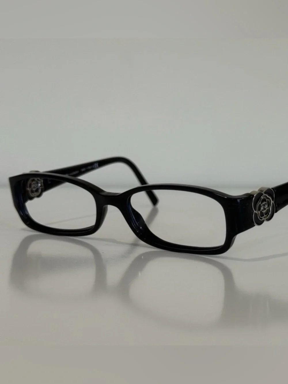 CHANEL Frame Black Rectangular Glasses with Camellia Temple Accent
